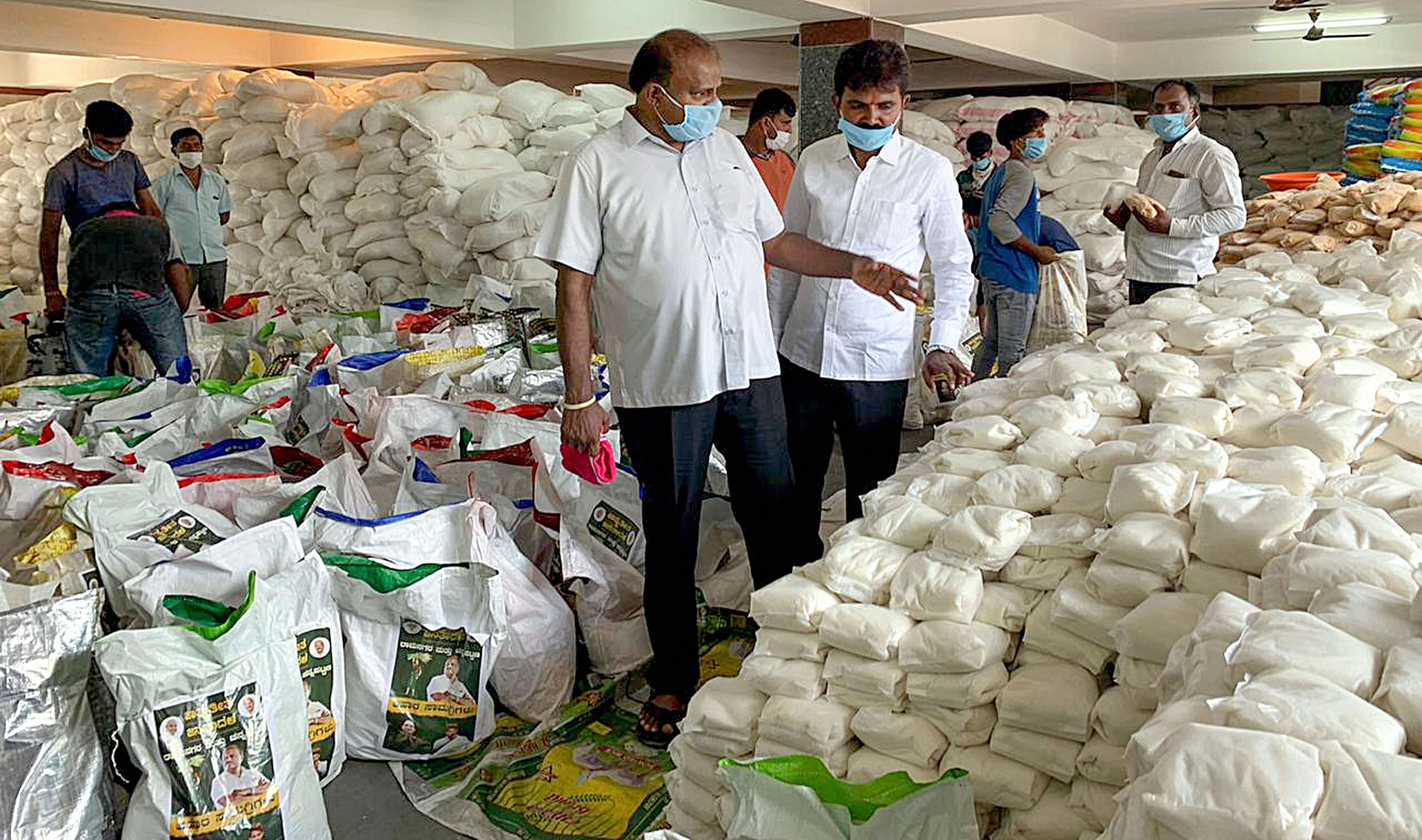 Former Chief Minister HD Kumaraswamy inspects before distributing essential items to needy people at Ramanagara and Channapatna (PTI)
