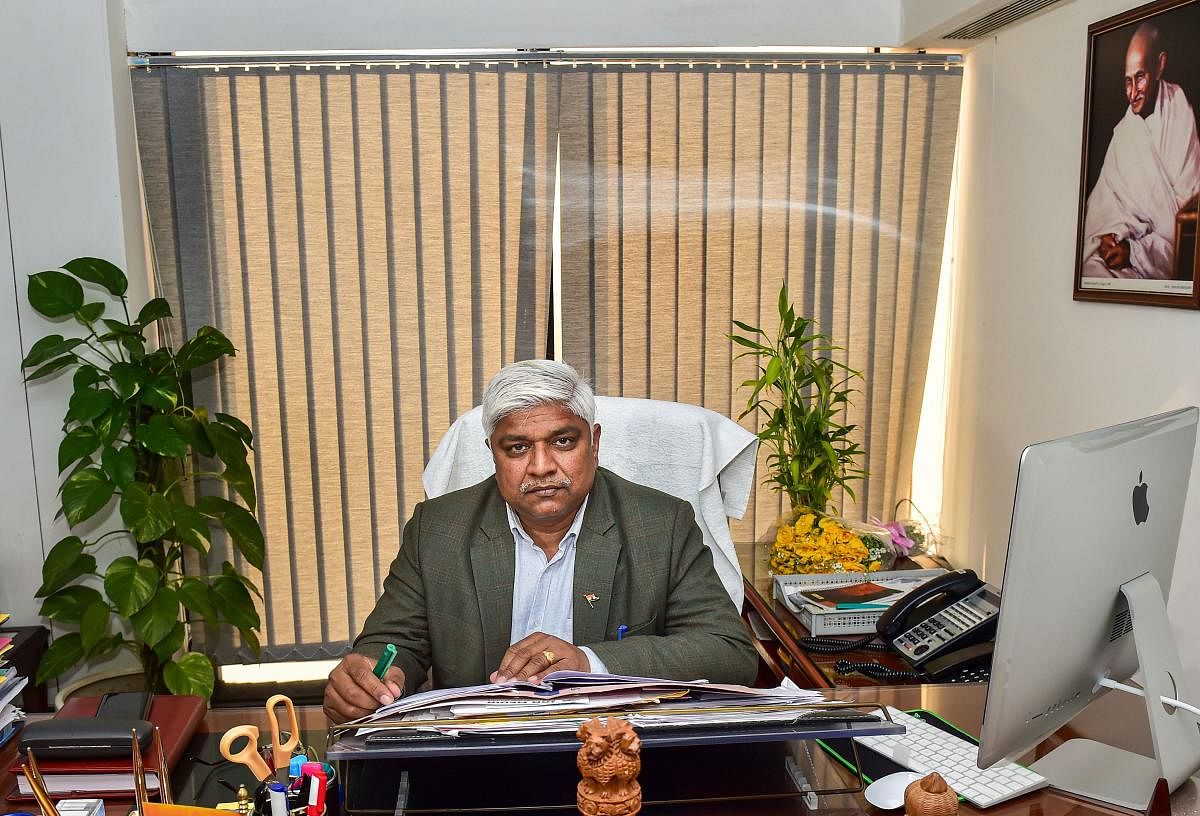 Senior Aam Aadmi Party leader Rajendra Pal Gautam takes charge of his office as a Delhi cabinet minister at Delhi Secretariat, in New Delhi. PTI