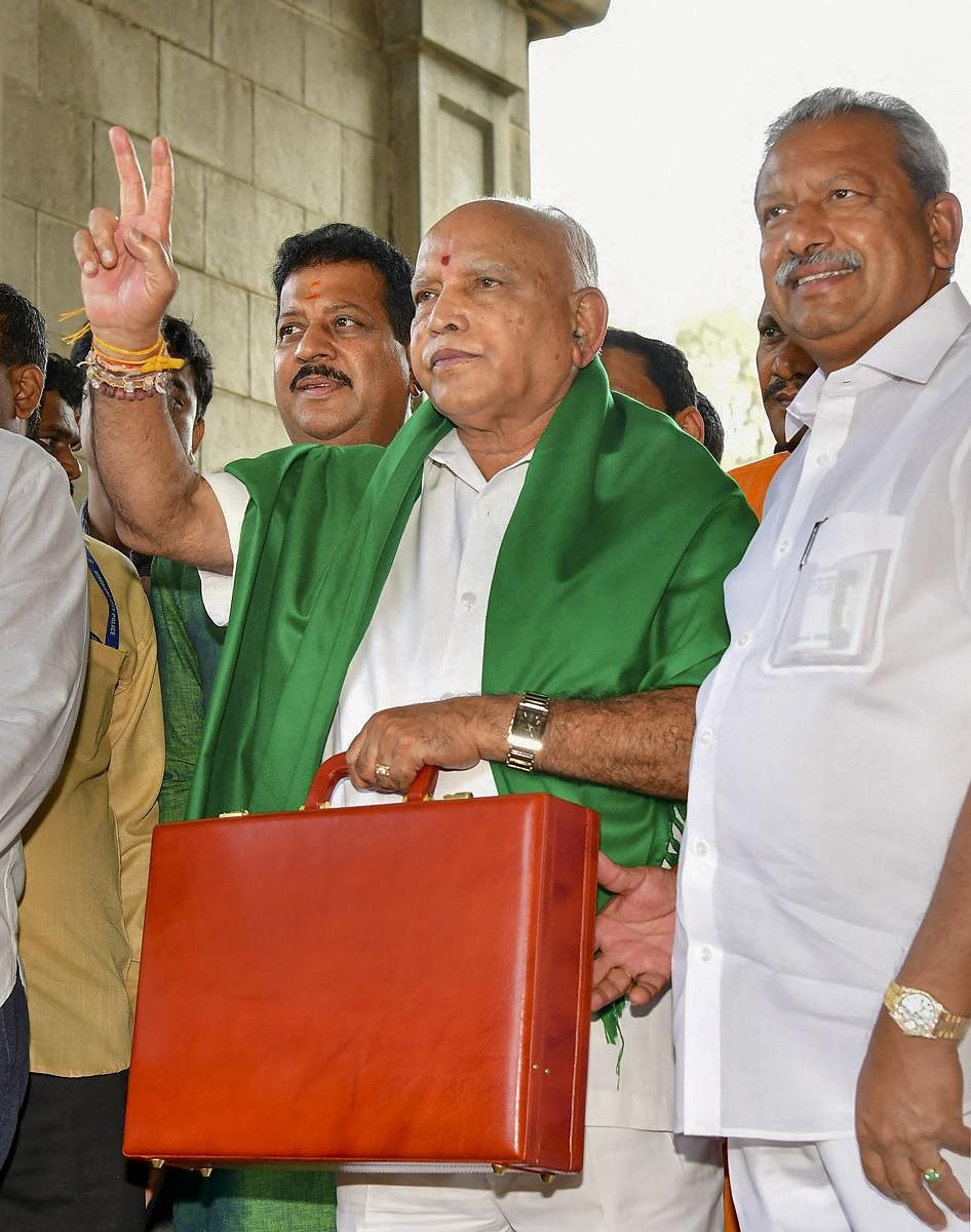 Karnataka Chief Minister BS Yediyurappa displays victory sign as he arrives to present the State Budget 2020-21 at Karnataka Assembly, in Bengaluru, Thursday, March 5, 2020. (PTI Photo)