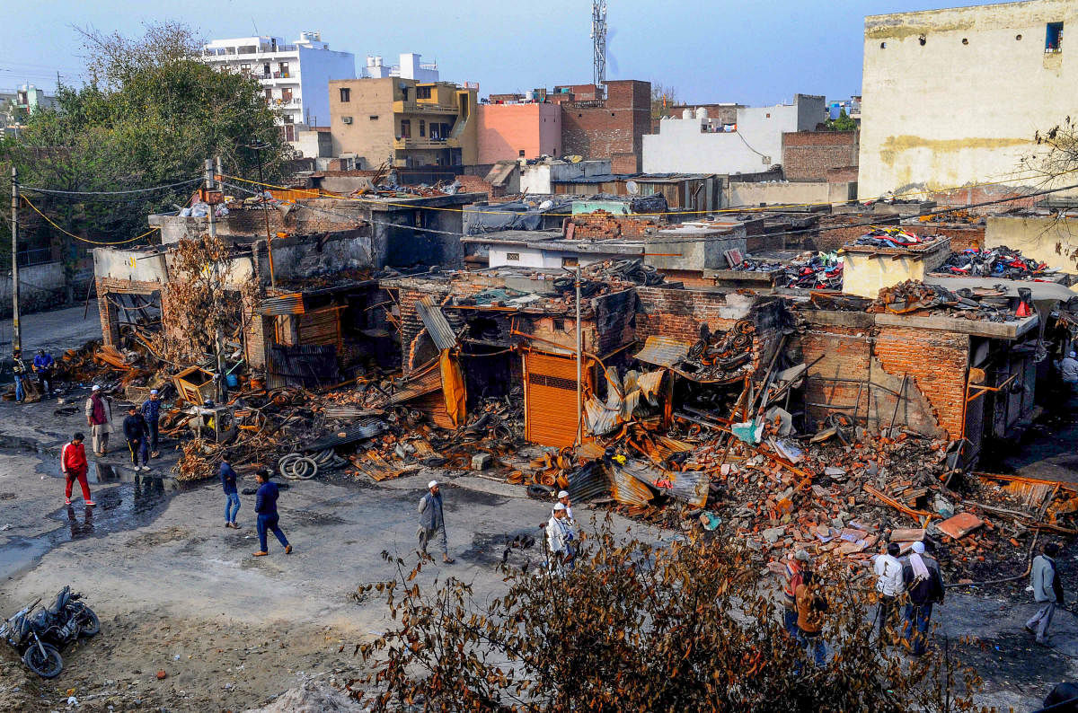 A view of the charred remains of the tyre market in riot affected Gokulpuri area of North East Delhi. (PTI Photo)