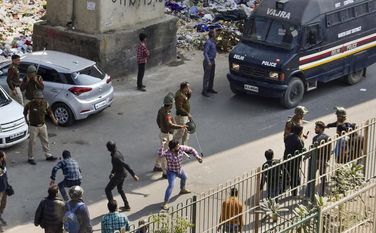 ro and anti-CAA protestors clash at Maujpur crossing in northeast Delhi. (PTI Photo)