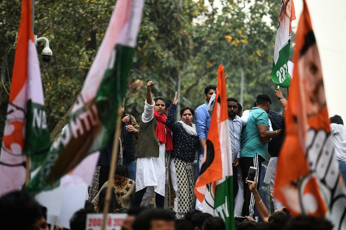 Indian Youth Congress activists shout slogans during a protest demanding the resignation of Home Minister Amit Shah and the registration of a First Information Report (FIR) against Bharatiya Janata Party (BJP) leaders Kapil Mishra, Anurag Thakur and Parvesh Verma for the hate speeches over last week's sectarian riots in India's capital, near the Parliament in New Delhi on March 2, 2020. (Photo by AFP)