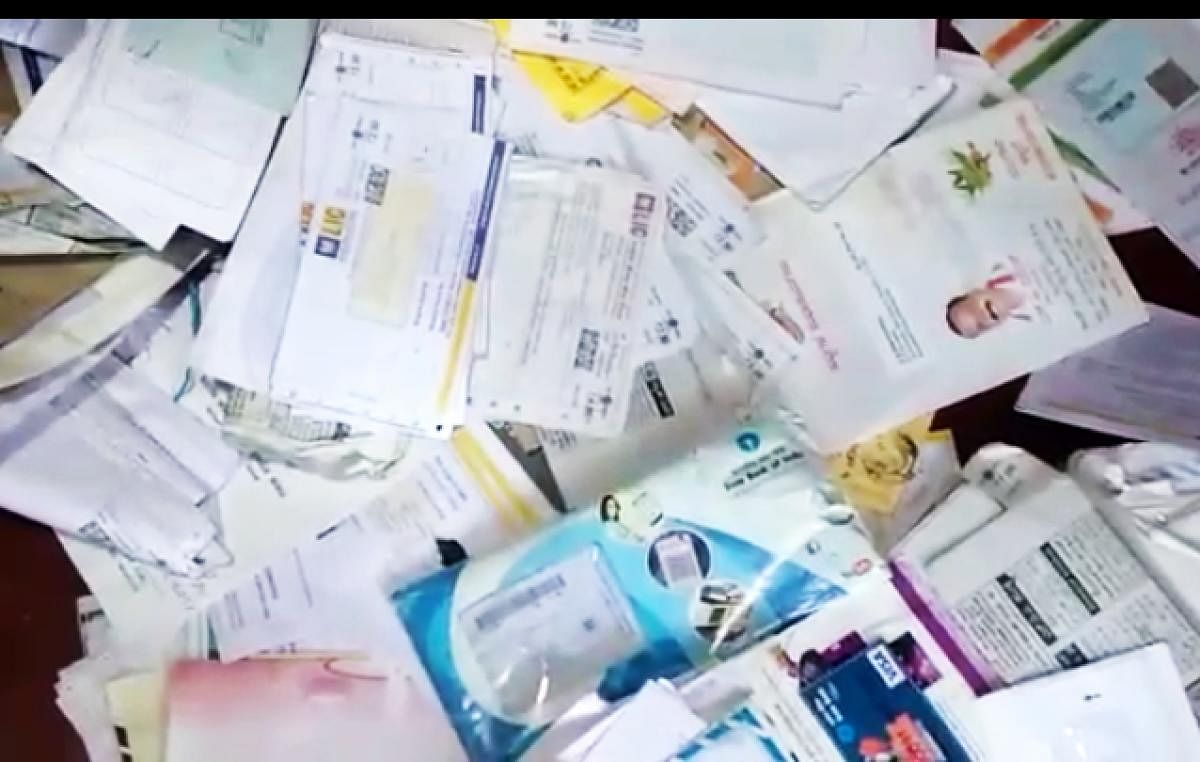 Documents that have not been delivered to the concerned people by a postman at Soorlabbi near Suntikoppa.
