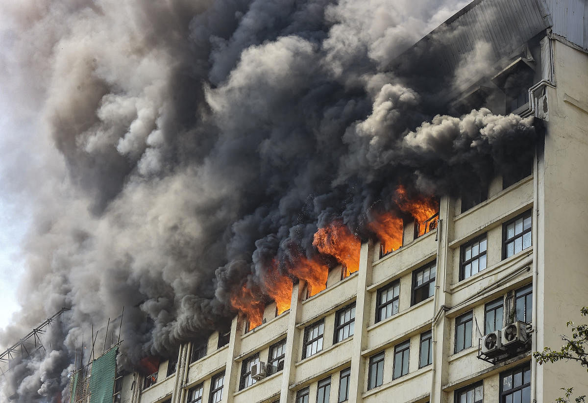 Smoke billows out from the GST Bhavan after a fire broke out on its eighth floor, in Mazgaon area of Mumbai, Monday, Feb. 17, 2020. (PTI Photo)