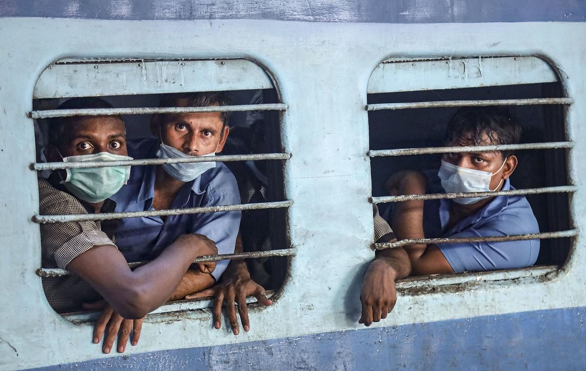 Passengers wearing masks in the wake of coronavirus (COVID-19) pandemic travel in a train, in Kozhikode, Monday, March 16, 2020. (PTI Photo)