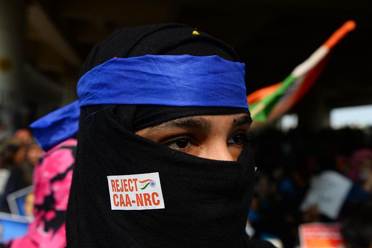 A demonstrator takes part in a protest against the Indian government's Citizenship Amendment Act (CAA) and the National Register of Citizens (NRC) at Jaffrabad area in New Delhi on February 23, 2020. Credit: AFP