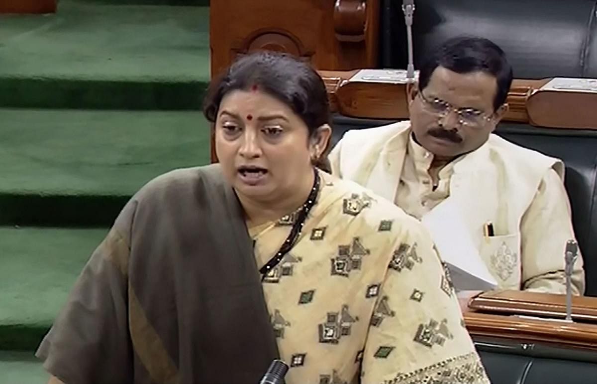 Women and Child Development Minister Smriti Irani speaks in the Lok Sabha during the Winter Session of Parliament. PTI