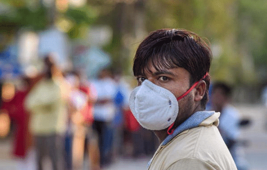A man is seen wearing a mask, as a precaution against the spread of the coronavirus (PTI Photo)