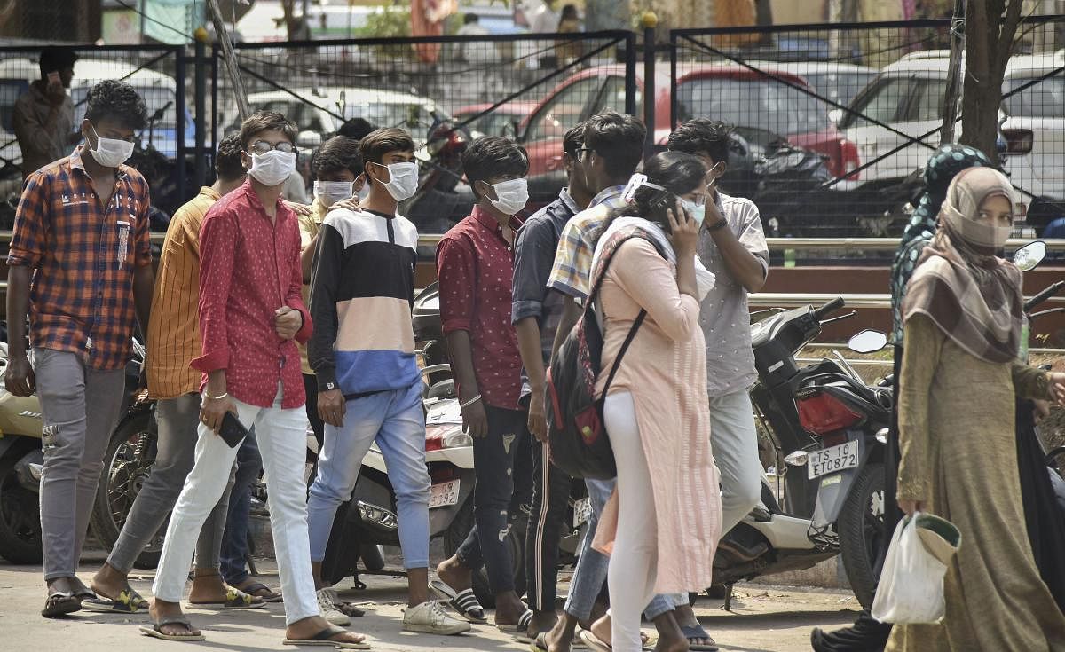 Visitors wear protective masks in wake of the deadly novel coronavirus, at Government Gandhi Hospital in Hyderabad, Tuesday, March 3, 2020.  Credit: PTI Photo