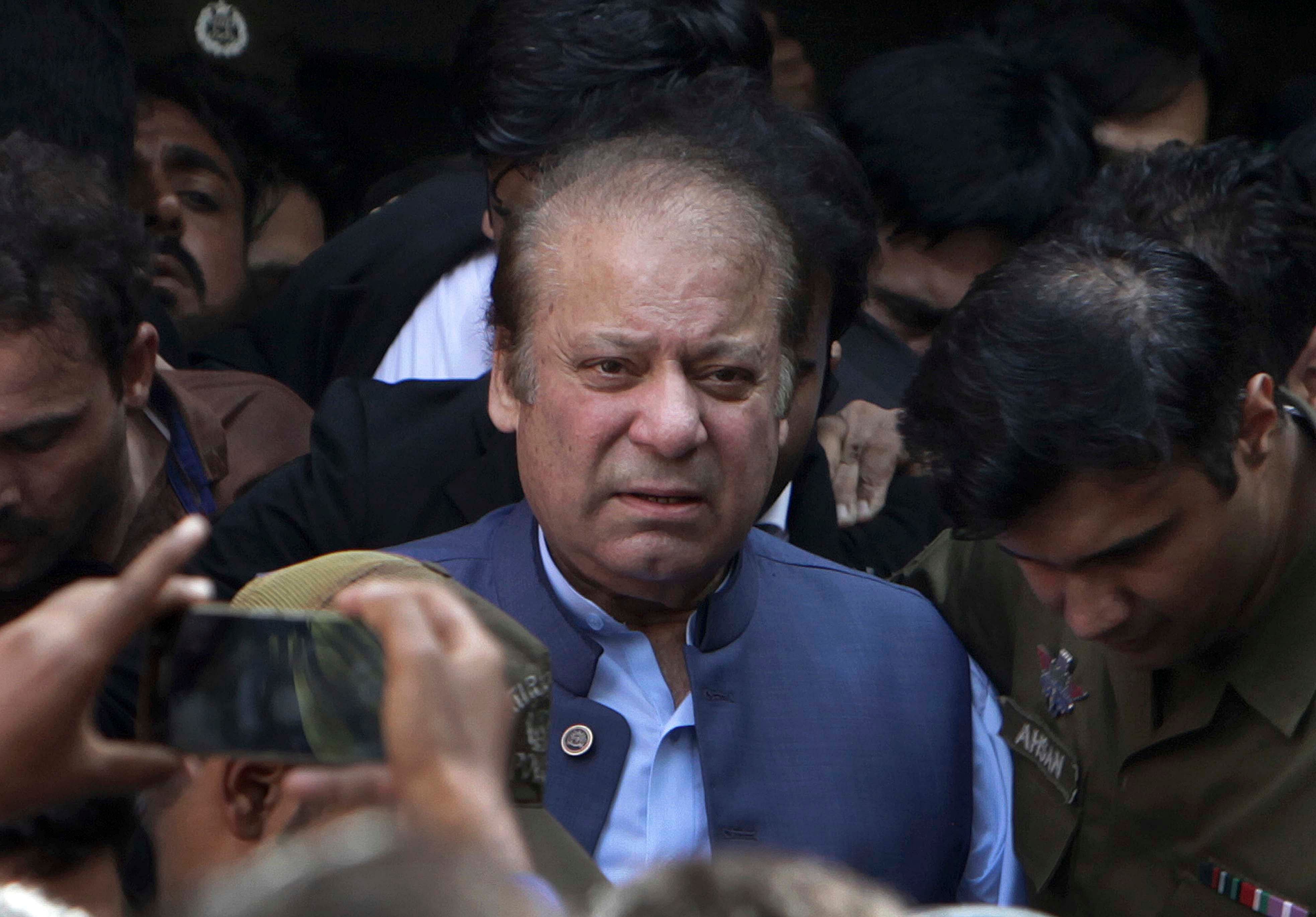 Former Pakistani Prime Minister Nawaz Sharif leaves after appearing in a court in Lahore, Pakistan. (PTI)