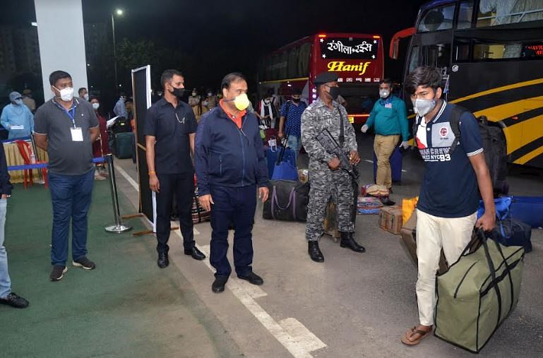 Assam health minister receiving the students at Sarusajai Sports Complex in Guwahati on the wee hours of Monday. (Photo by Manash Das/Guwahati) 