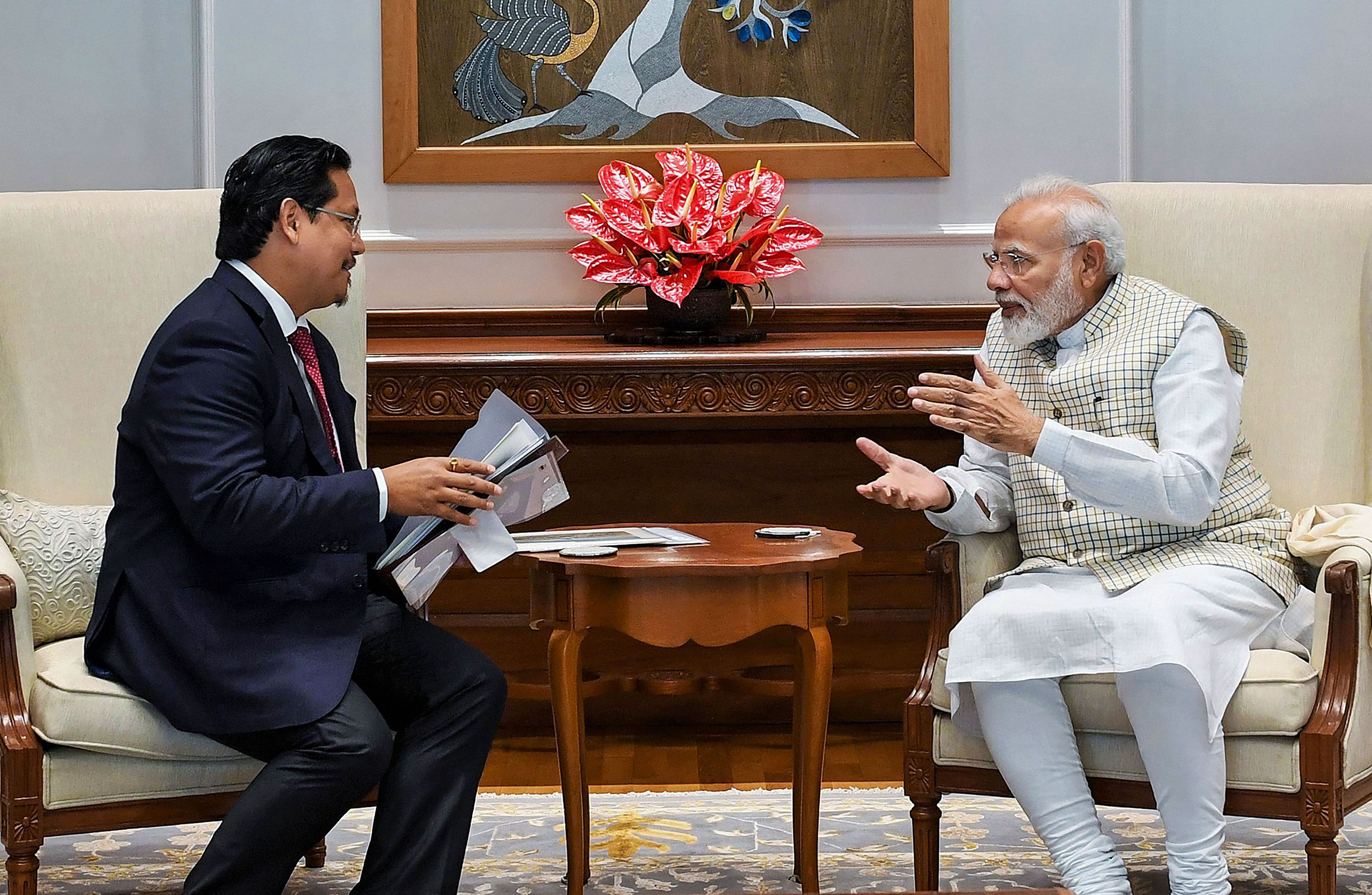 Prime Minister Narendra Modi and Meghalaya Chief Minister Conrad K. Sangma. (PTI Photo)