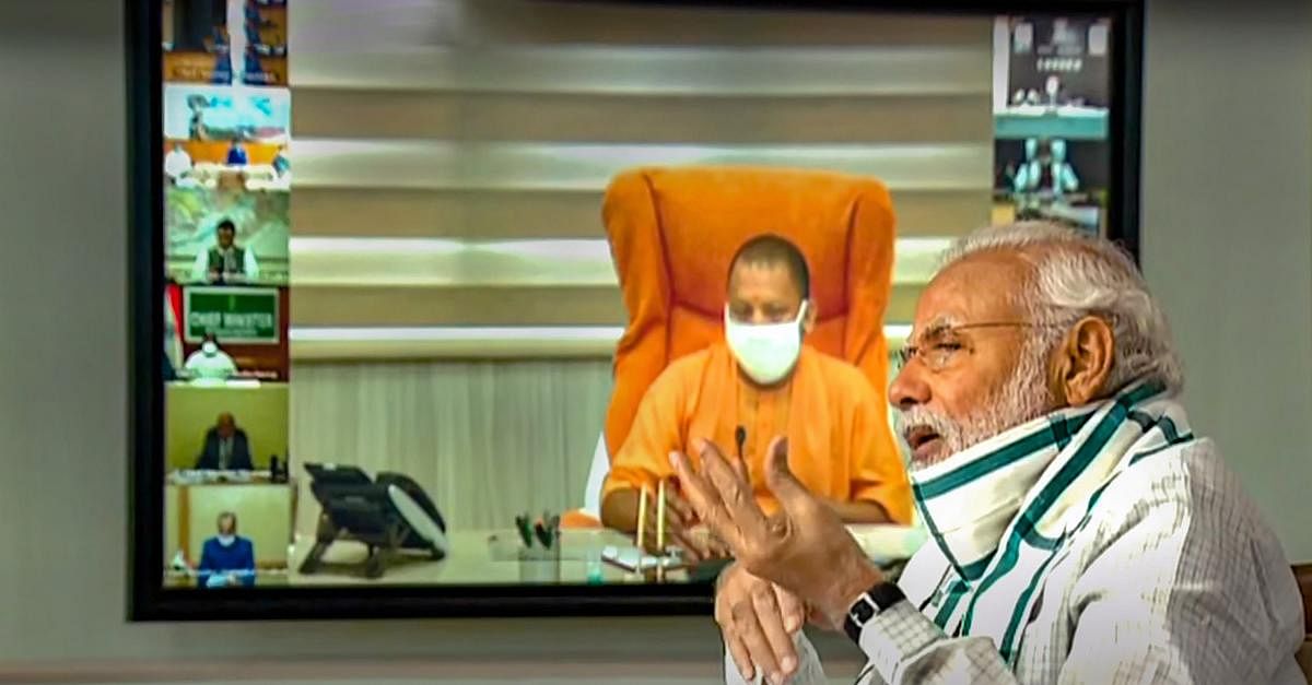 Prime Minister Narendra Modi (front) interacts with the Chief Ministers of various States/UTs via video conferencing to discuss the situation arising due to the novel coronavirus pandemic, in New Delhi, Monday, April 27, 2020. UP CM Yogi Adityanath is also seen on the screen. (TV GRAB/PTI Photo) 