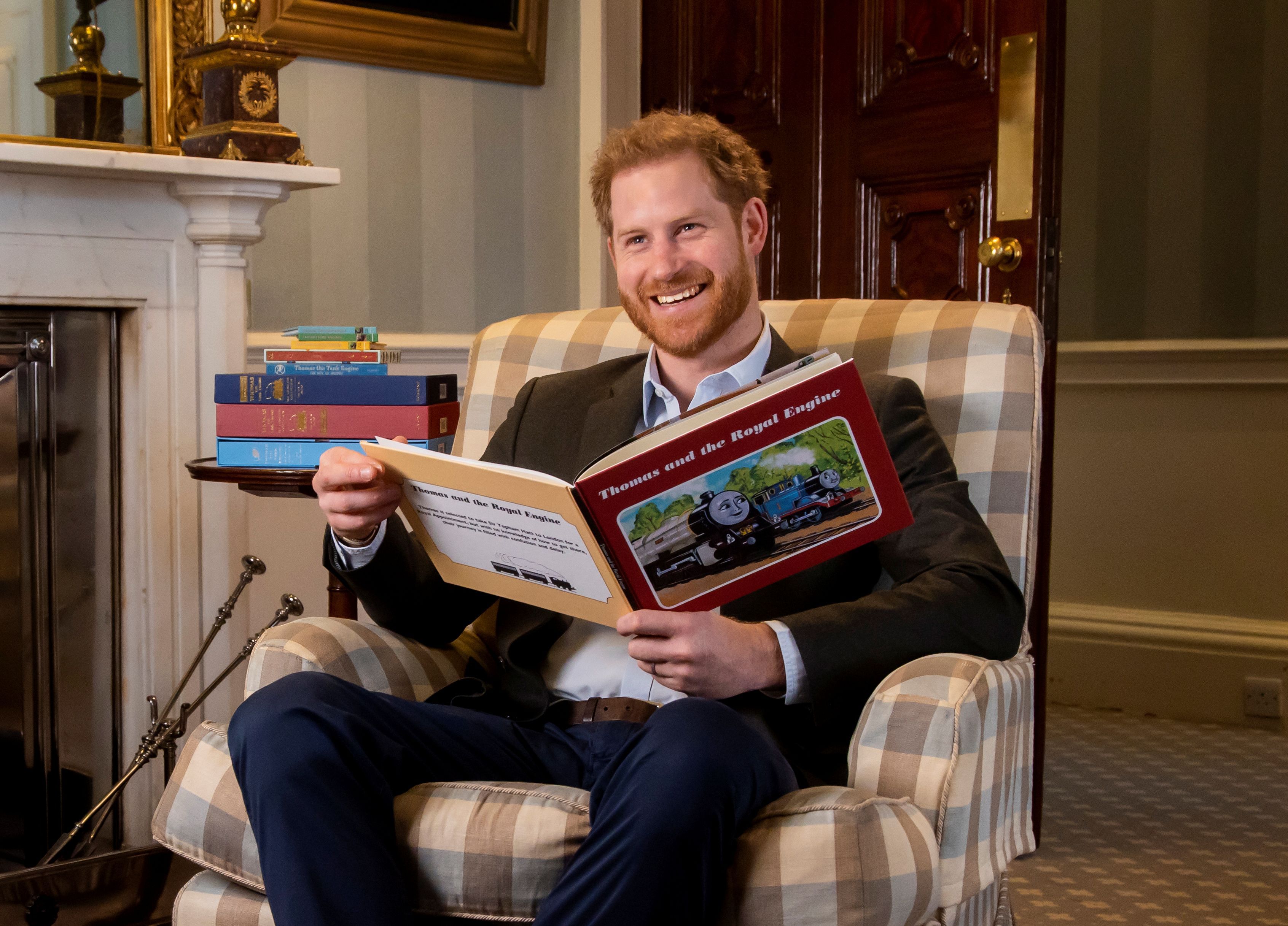 Britain's Prince Harry is pictured during the recording of his on-camera introduction to the new animated special "Thomas & Friends: The Royal Engine" featuring Britain's Queen Elizabeth and Britain's Prince Charles as a child. (Reuters)