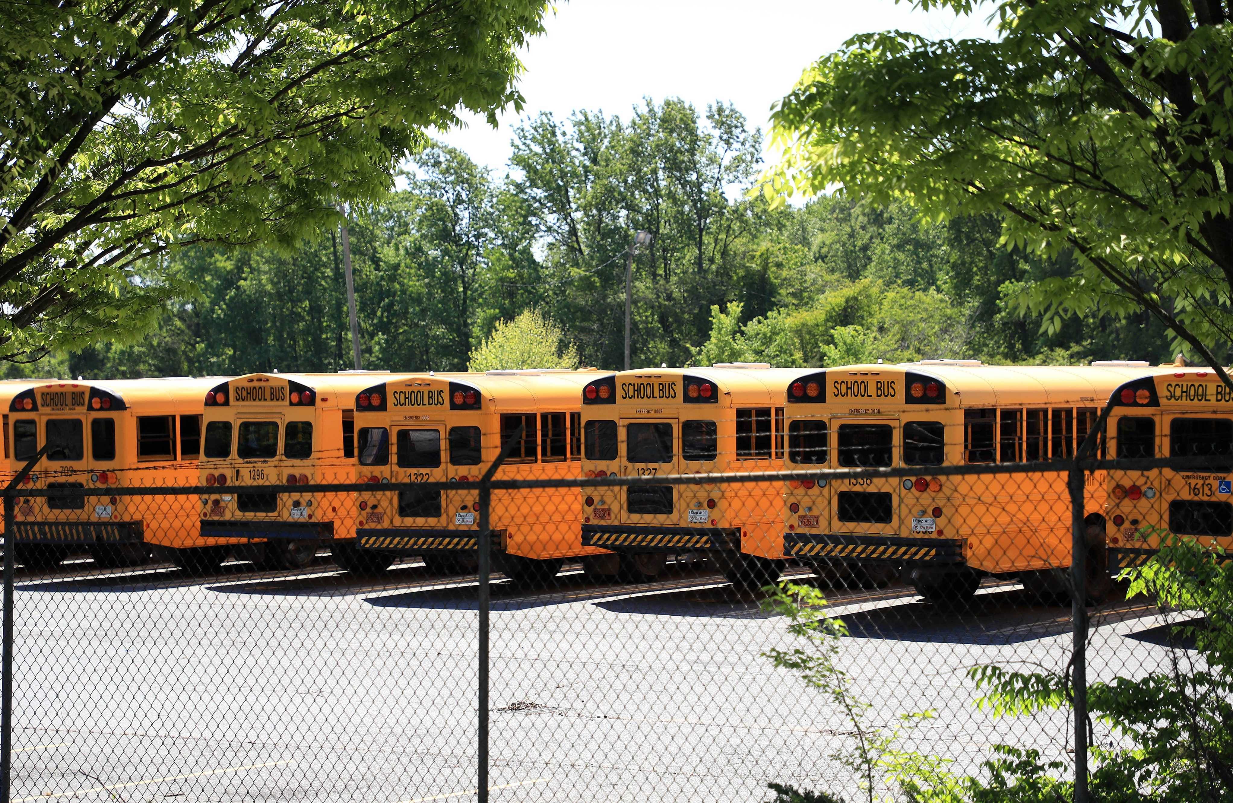 Parked school busses sit in a lot during the coronavirus (COVID-19) pandemic in Charlotte, North Carolina. (AFP)