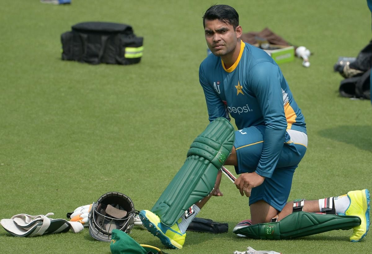 In this file photo taken on March 13, 2016 Pakistan's Umar Akmal pads up as he takes part in a training session ahead of the World T20 cricket tournament match at The Eden Gardens Cricket Stadium in Kolkata. Credit: AFP Photo