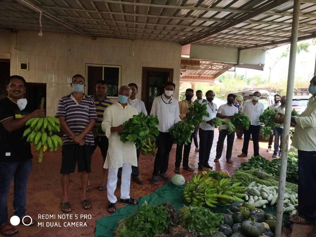 Former MLA J R Lobo procures vegetables from a farmer at Merlapadavu.