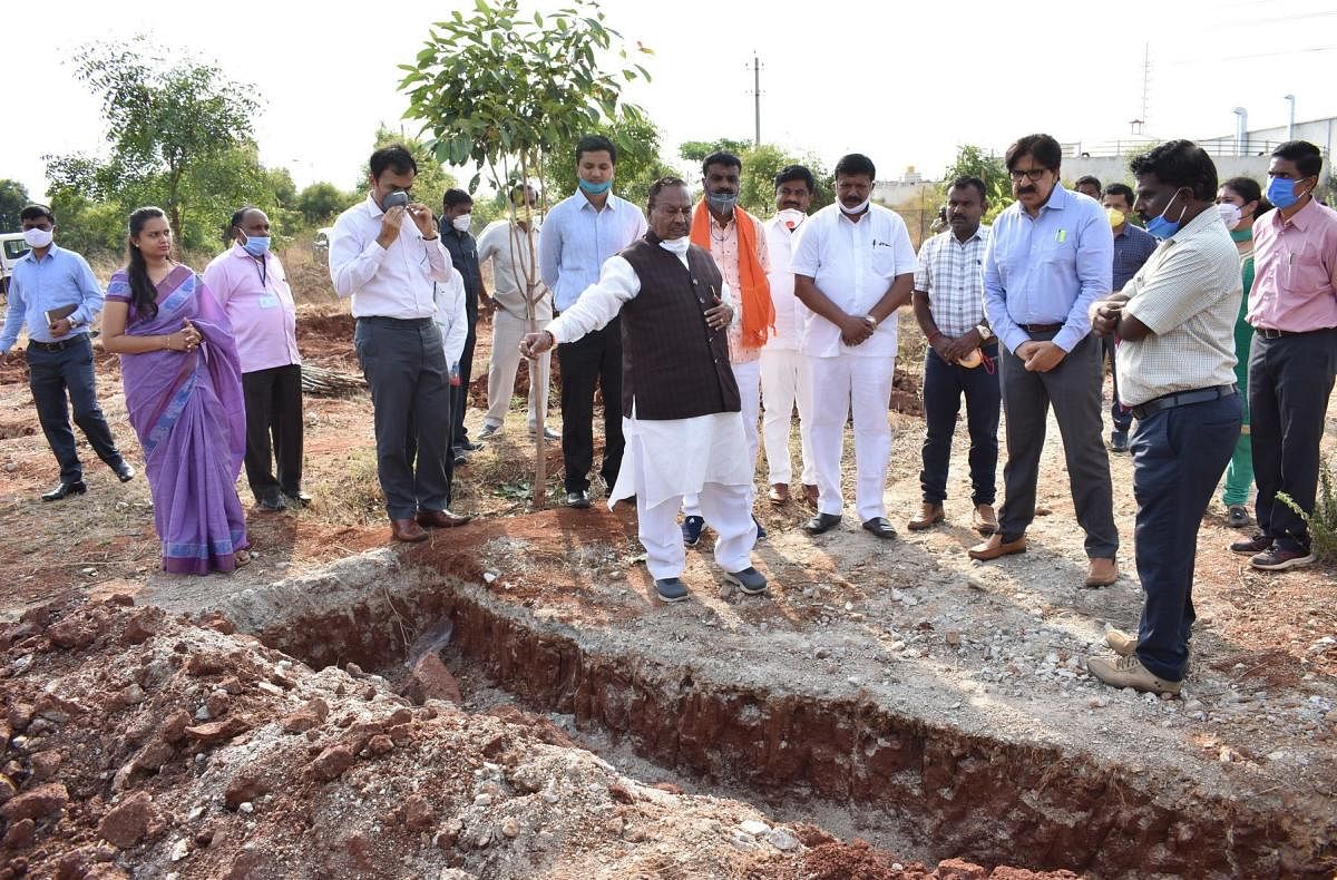 Rural Development and Panchayat Raj Minister K S Eshwarappa inspects a project at Narasapur in Kolar district on Monday.