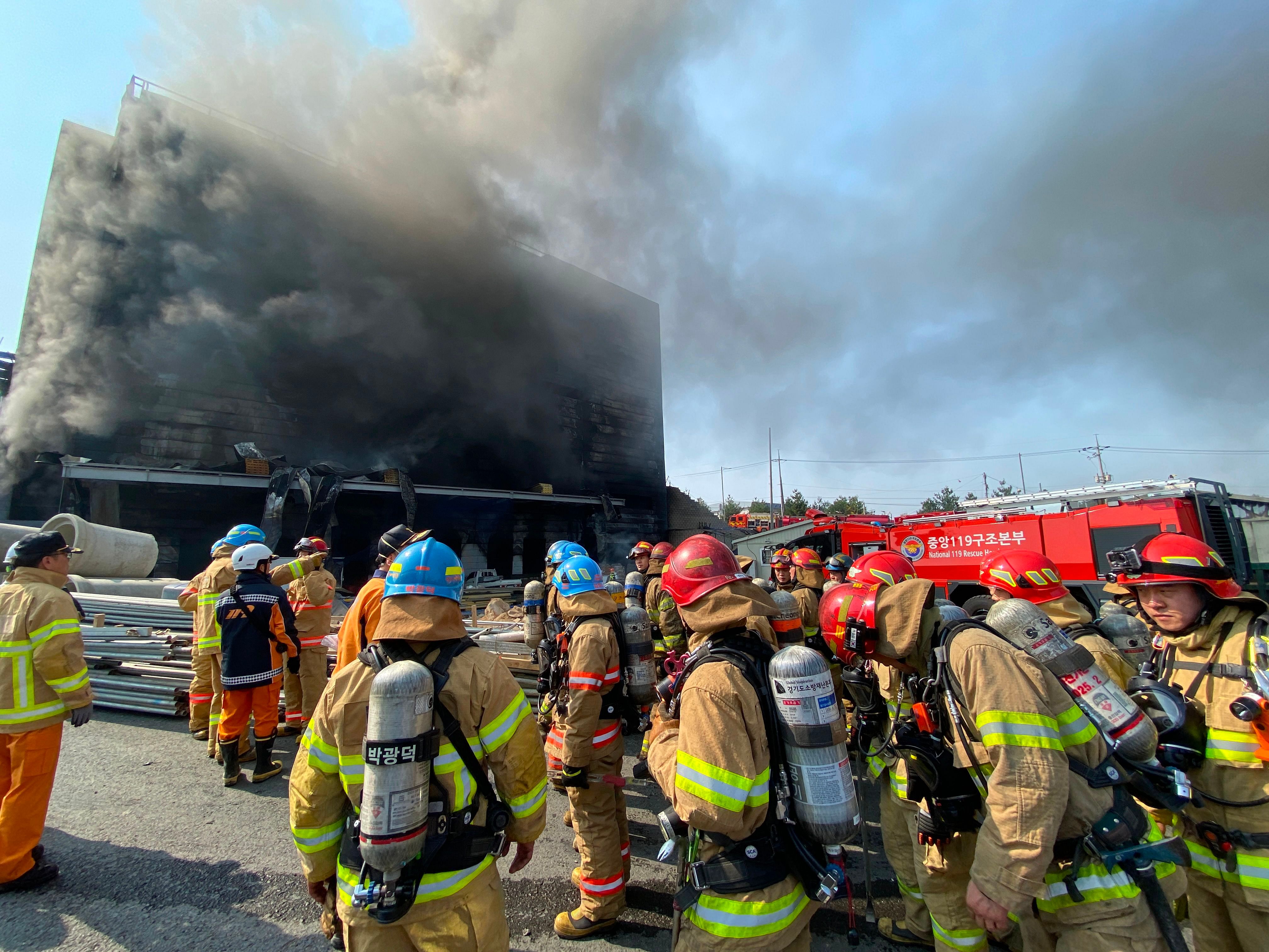 Gyeonggi Province Fire Services shows firefighters working at the scene of a fire at a warehouse in Icheon. - A fire at a warehouse in South Korea killed 25 people. (AFP Photo)