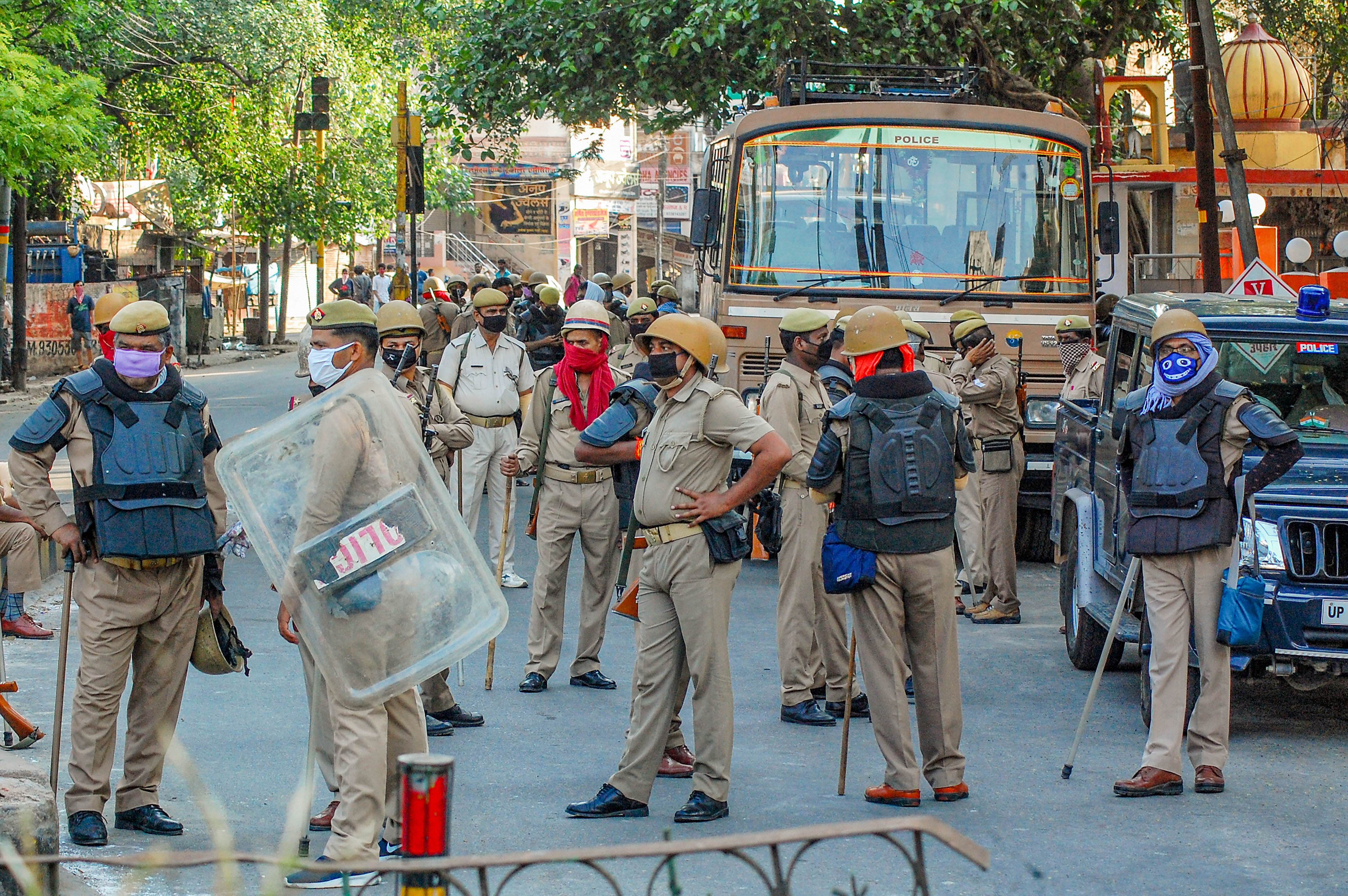 Heavy security deployment after locals allegedly pelted stones on a team of doctors and police officials, who had gone for a check-up of coronavirus suspects in one of the hotspot area, near Gulab Ghosi Masjid in Kanpur. (PTI Photo)