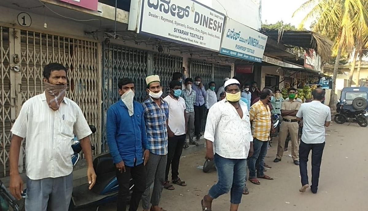  Residents curiously watch tashildar Shobitha and police conducting inspection at at Bha-Ki Masjid in Kolar on Thusday.   