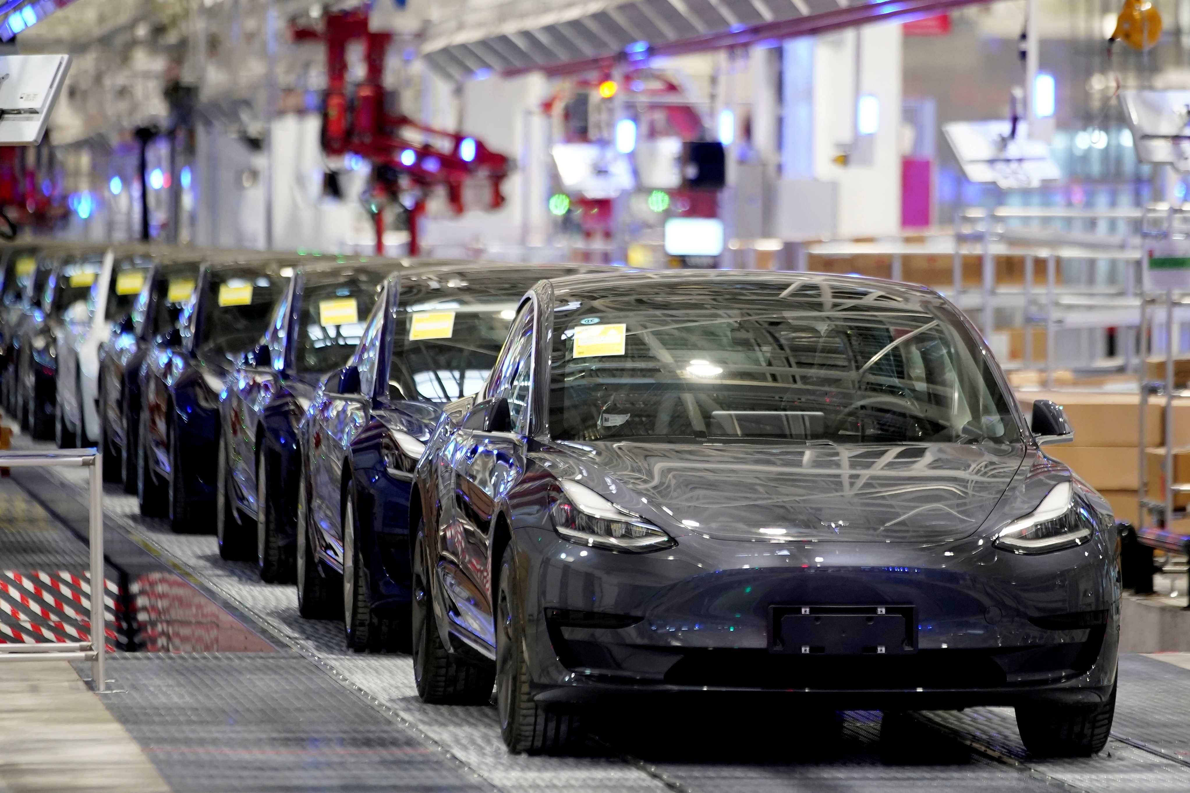 Tesla China-made Model 3 vehicles are seen during a delivery event at its factory in Shanghai. (Credit: Reuters)