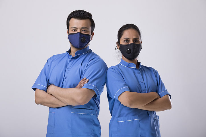 Nurse wearing protective face mask to prevent from virus disease (iStock Photo)