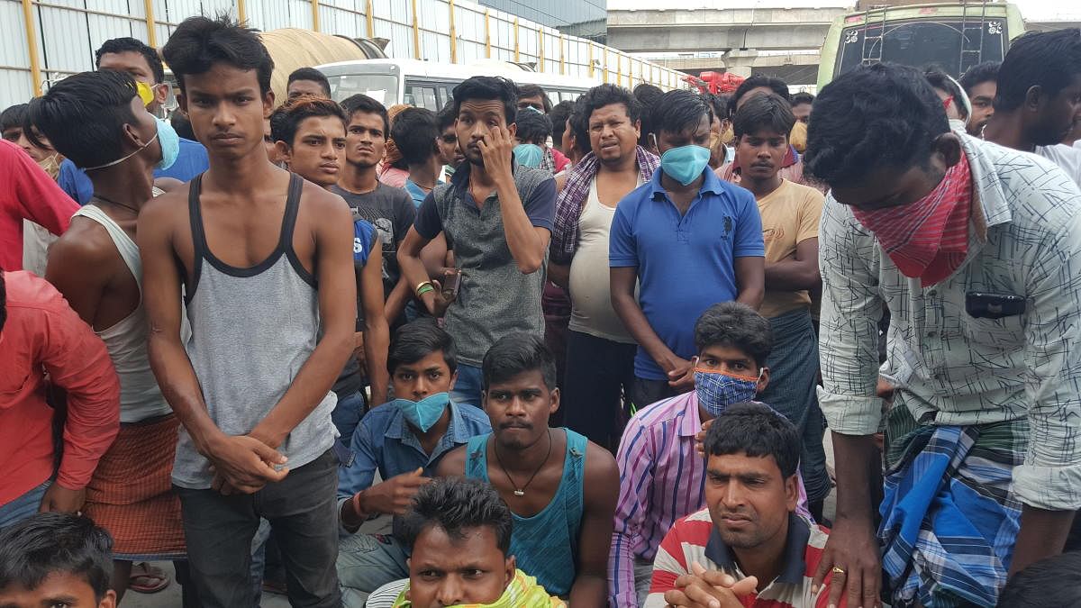 Workers of Namma Metro's casting yard at Bommanahalli request for wages and transport arrangement to return to their home towns in other states. DH Photo/CK