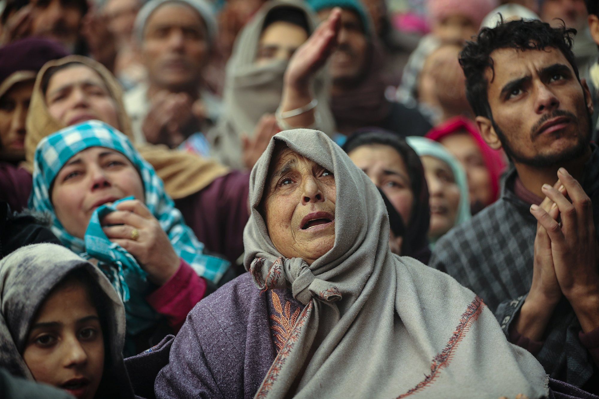 Kashmiri Muslim devotees offer prayer outside the shrine of Sufi saint Sheikh Syed Abdul Qadir Jeelani in Srinagar, Indian controlled Kashmir, Dec. 9, 2019. Hundreds of devotees gathered at the shrine for the 11-day festival that marks the death anniversary of the Sufi saint. The image was part of a series of photographs by Associated Press photographers which won the 2020 Pulitzer Prize for Feature Photography. (AP Photo/Mukhtar Khan)
