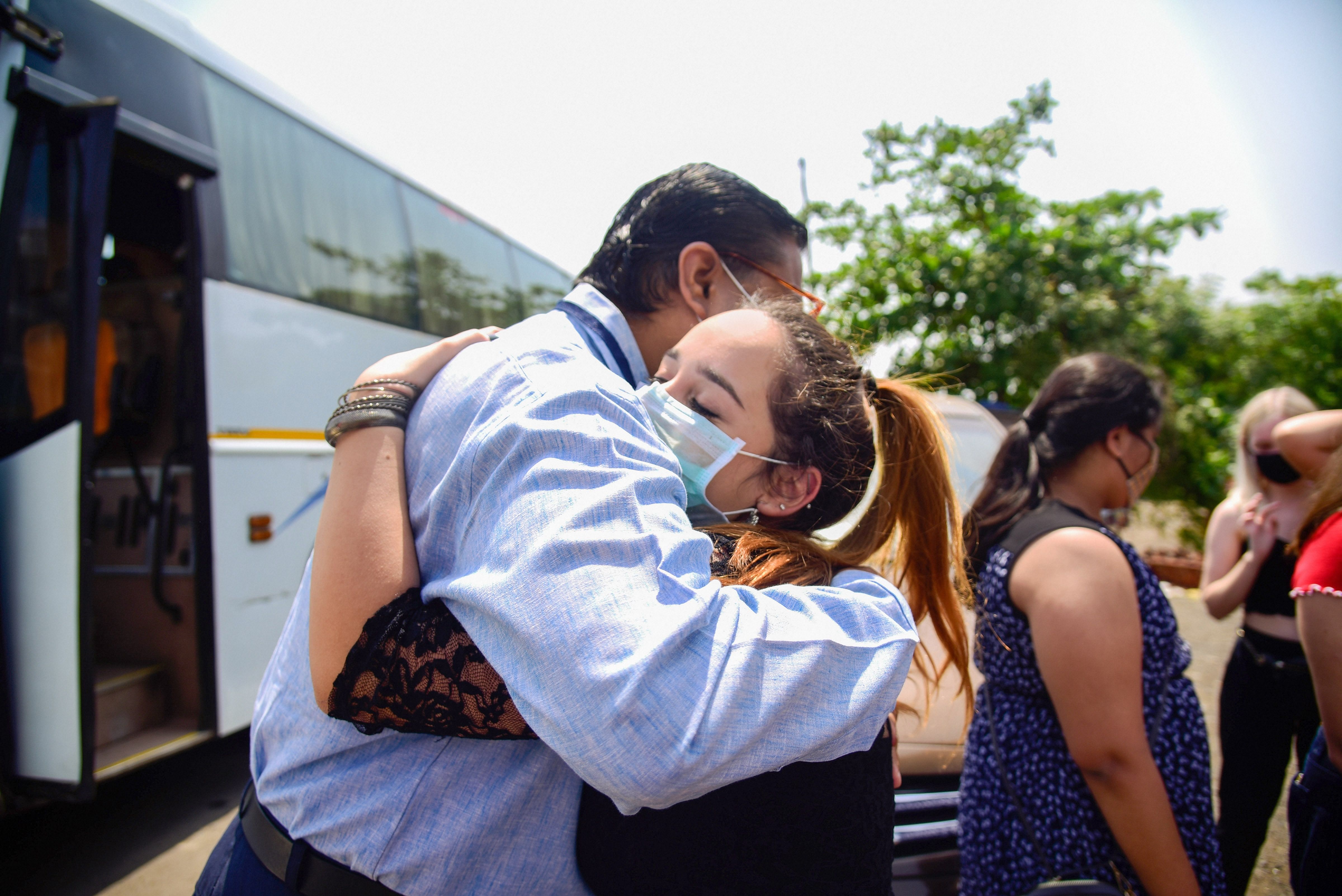Students from Brazil see off their local guardians as they leave for Mumbai International Airport to catch the flight towards their native country, during the nationwide lockdown in wake of coronavirus pandemic. (PTI Photo)