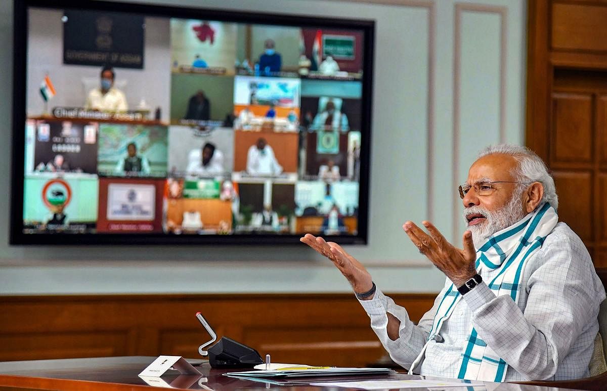 New Delhi: Prime Minister Narendra Modi (foreground) interacts with the Chief Ministers of various States/UTs via video conferencing to discuss the situation arising due to the novel coronavirus pandemic, in New Delhi, Monday, April 27, 2020. (PTI Photo)(