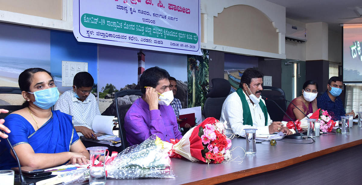 Agriculture Minister B C Patilchairs a review meeting at DC's office in Mangaluru.DH photo