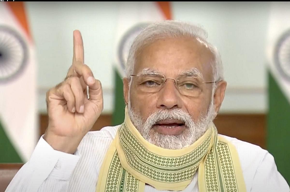 Prime Minister Narendra Modi interacts with 'Sarpanches' from across the country via video conferencing, amid ongoing nationwide COVID-19 lockdown, in New Delhi, Friday, April 24, 2020. (DD/PTI Photo)