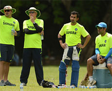 India's coach Duncan Fletcher (2nd L) stands with bowling coach Joe Dawes (L) as Gautam Gambhir and captain Mahendra Singh Dhoni (R) look on at a training session at Nondescripts cricket club in Colombo September 18, 2012, ahead of their Group A World Twenty20 match against Afghanistan on Wednesday. REUTERS