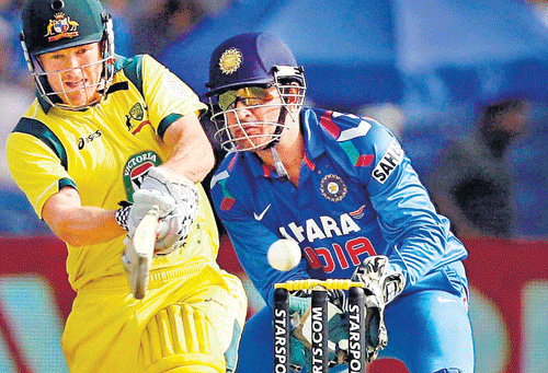 explosive: Australian skipper George Bailey pulls en route his 85 against India in the first one-dayer at Pune on Sunday. Bailey's knock helped his team win by 72 runs. pti