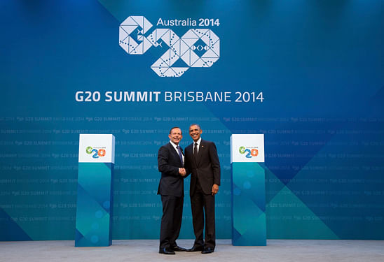 Australian Prime Minister Tony Abbott shakes hands with U.S. President Barack Obama as he officially welcomes leaders to the G20 leaders summit in Brisbane. Reuters image