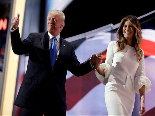 Republican presidential candidate Donald Trump gives his thumb up as he walks off the stage with his wife Melania during the Republican National Convention, Monday, July 18, 2016, in Cleveland. AP/PTI Photo