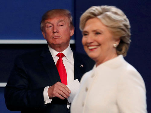 Republican U.S. presidential nominee Donald Trump and Democratic U.S. presidential nominee Hillary Clinton finish their third and final 2016 presidential campaign debate at UNLV in Las Vegas, Nevada, U.S., October 19, 2016. REUTERS