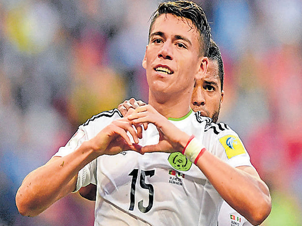 Mexico defender Hector Moreno celebrates after scoring against Portugal on Sunday. AFP Photo