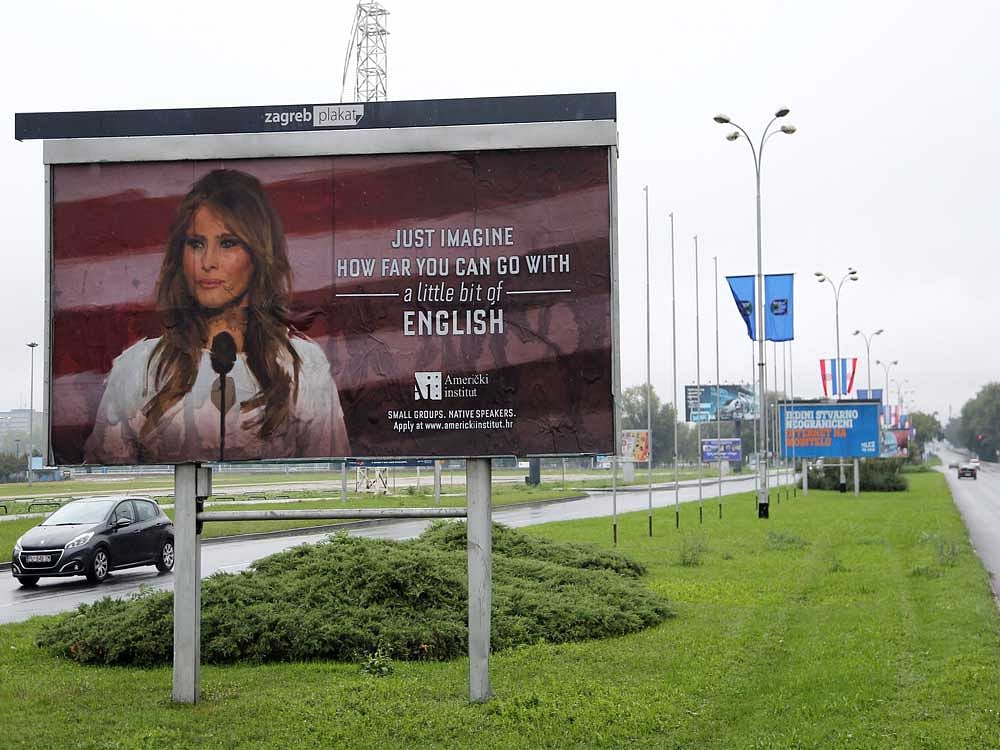 Cars drive near a billboard advertising a language school with the image of U.S. first lady Melania Trump in Zagreb, Croatia. Reuters Photo
