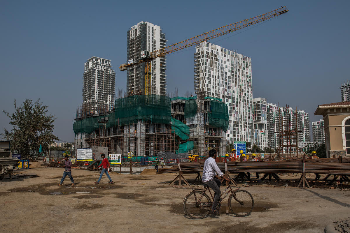 A Trump-branded complex under construction in Guragon, a fast-growing city outside New Delhi, Feb. 16, 2018. India is the Trump Organization's biggest international market, with four real estate projects underway; The Trumps and their partners pitch buyers the opportunity to become