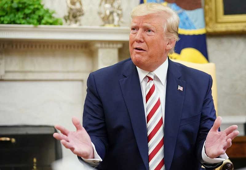 Speaking a day after phone calls with the premiers of both countries, Trump said he was happy to try and help calm the situation in Kashmir where tensions have spiked since India revoked autonomous rule in the part of the region it controls on August 5. (AFP Photo)
