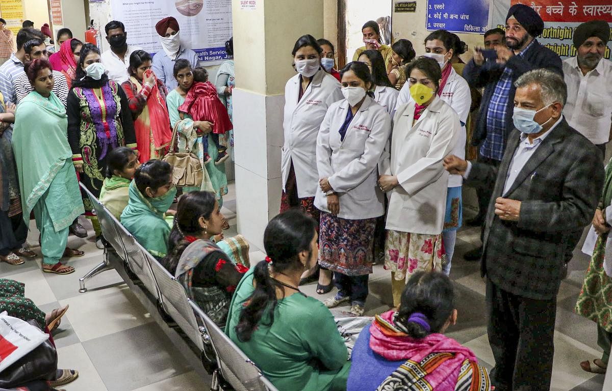 Doctors and nurses speak during an awareness event against coronavirus at a government hospital, in Jammu. (PTI Photo)
