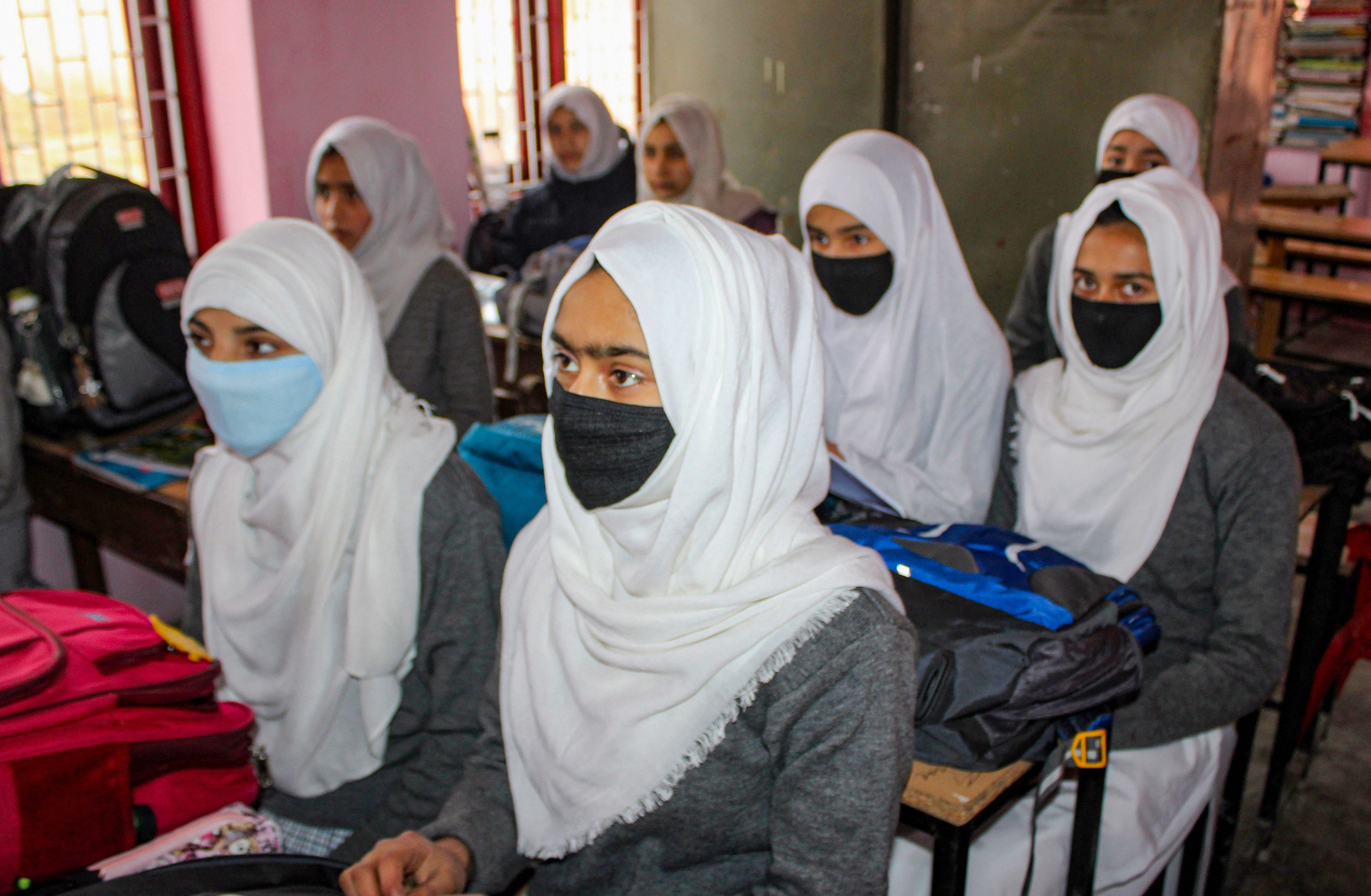 Students wear masks to mitigate the spread of coronavirus, at a school in Srinagar. (PTI Photo)