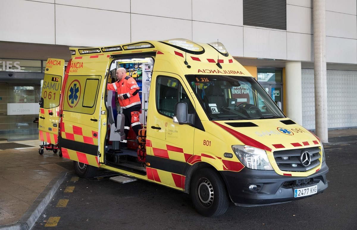An ambulance is parked outside the Son Espases University Hospital in Palma de Mallorca where a British man has been diagnosed with coronavirus,(AFP Photo)