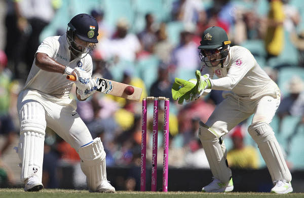 In this Jan. 4, 2019, file photo, India's Rishabh Pant, left, plays a shot in front of Australia's Tim Paine on day 2 during their cricket test match in Sydney. Cricket Australia is considering an expanded five-test series against India next season and is still planning to host the Twenty20 World Cup later this year, even if it has to be staged in empty stadiums. (AP/PTI Photo)