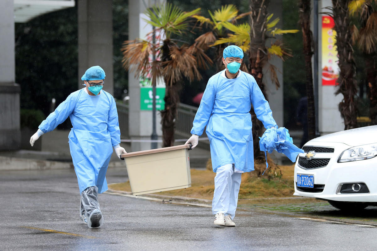 Medical staff carry a box as they walk at the Jinyintan hospital, where the patients with pneumonia caused by the new strain of coronavirus are being treated, in Wuhan, Hubei province, China January 10, 2020. Credit: Reuters photo