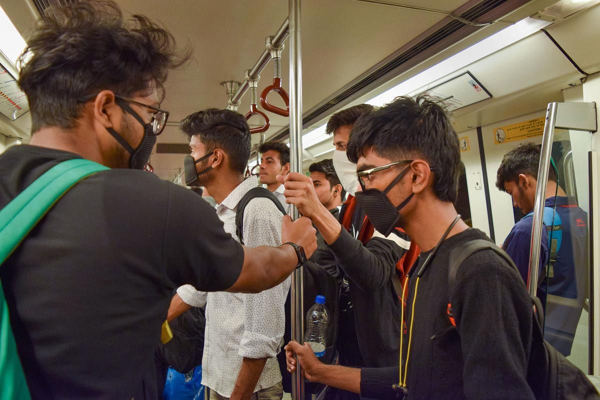  Passengers wear masks to mitigate the spread of coronavirus while travelling in a metro, in New Delhi, Thursday, March 5, 2020. (PTI Photo)