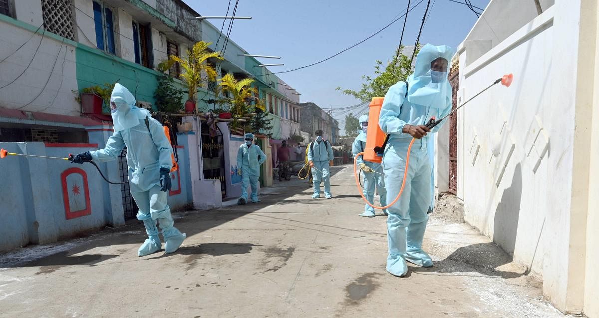  Municipal corporation workers sanitize the premises of a quarantine centre during ongoing COVID-19 lockdown (PTI Photo)