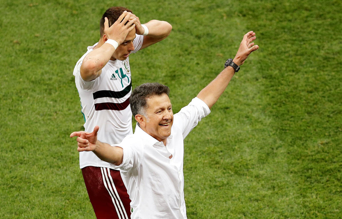 Mexico coach Juan Carlos Osorio and Javier Hernandez celebrate victory after the match.  Group F - South Korea vs Mexico - Rostov Arena, Rostov-on-Don, Russia - June 23, 2018. 
